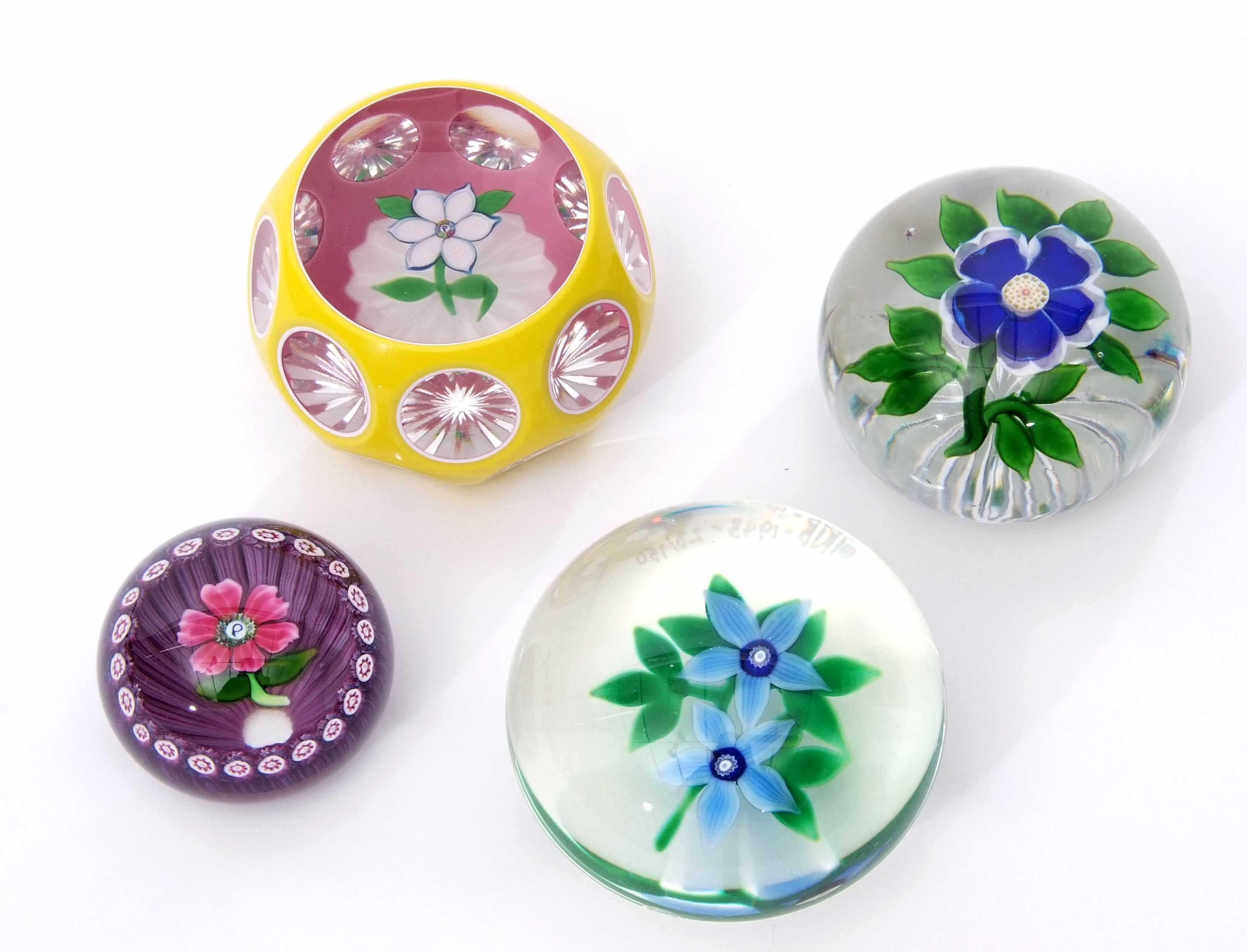 Group of four paperweights including a Baccarat primrose weight with a blue flower with white - Image 5 of 8