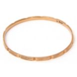 Early 20th century 9ct gold bangle, textured design, Birmingham 1924, 7cm diam, 17.8g