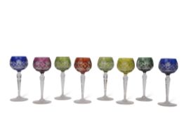 Group of eight English cut glass wine glasses or hock glasses, various colours, two blue stained,