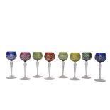 Group of eight English cut glass wine glasses or hock glasses, various colours, two blue stained,