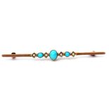 Antique turquoise and seed pearl brooch featuring three graduated turquoises between four small seed