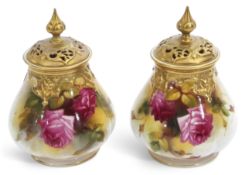 Pair of Royal Worcester pot pourri vases with gilt reticulated covers, painted with roses, one