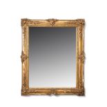 19th century gilt and gesso rectangular wall mirror with floral encrusted corners and a moulded