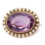 Early 19th century amethyst and seed pearl brooch, the oval faceted amethyst millegrain set within a
