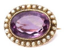 Early 19th century amethyst and seed pearl brooch, the oval faceted amethyst millegrain set within a