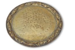 Early 20th century Arts & Crafts circular brass tray, having foliate and scrolled edge, spot