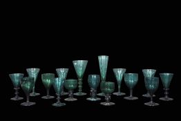 Collection of green glass wares mainly 19th century including two small glasses with bucket shaped