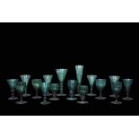 Collection of green glass wares mainly 19th century including two small glasses with bucket shaped