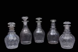 Group of four 19th century cut glass decanters with mushroom stoppers, together with a further