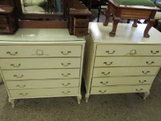 PAIR OF CREAM AND GILDED FIVE FULL WIDTH DRAWER CHESTS ON SHAPED FEET