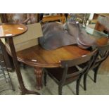 19TH CENTURY MAHOGANY OVAL EXTENDING DINING TABLE ON REEDED LEGS, RAISED ON PORCELAIN CASTERS (