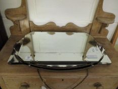 THREE 1920S FRAMELESS MIRRORS TO INCLUDE AN OVAL MIRROR, A RECTANGULAR MIRROR WITH CANTED CORNERS