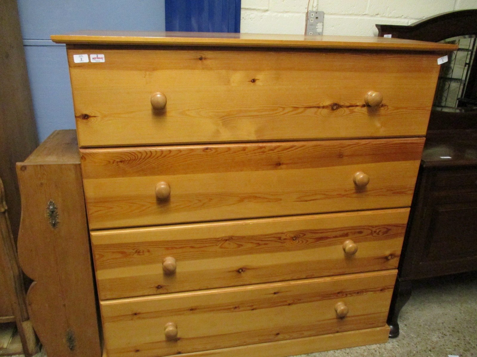 EXTREMELY LARGE STAINED PINE FOUR FULL WIDTH DRAWER CHEST WITH TURNED KNOB HANDLES