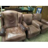 MODERN LEATHER UPHOLSTERED WING FIRESIDE CHAIR AND A PAIR OF CHOCOLATE LEATHER UPHOLSTERED CLUB