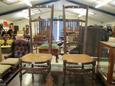PAIR OF OAK FRAMED STICK BACK HIGH BACK CHAIRS WITH RATTAN UPHOLSTERED SEATS AND TURNED FRONT