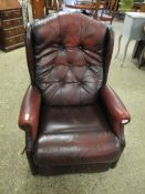 AN OX-BLOOD LEATHER AND BUTTON BACK RECLINER LAZYBOY ARMCHAIR