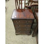 REPRODUCTION MAHOGANY BACHELOR'S CHEST WITH FOUR FULL WIDTH DRAWERS RAISED ON BRACKET FEET