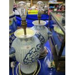 PAIR OF MODERN BLUE AND WHITE ORIENTAL INFLUENCED LAMPS (LACKING SHADES)