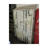 VICTORIAN PINE PAINTED CUPBOARD WITH SLOPED TOP AND TWO CUPBOARD DOORS WITH BRASS BUTTON HANDLES