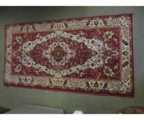 SMALL CARPET WITH RED GROUND