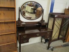 MAHOGANY FRAMED DRESSING CHEST WITH OVAL MIRRORED BACK WITH OPEN SHELF AND TWO DRAWERS, THE BASE