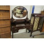 MAHOGANY FRAMED DRESSING CHEST WITH OVAL MIRRORED BACK WITH OPEN SHELF AND TWO DRAWERS, THE BASE