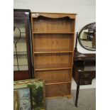 PINE FRAMED PANELLED BACK OPEN FRONTED FOUR FIXED SHELF BOOKCASE