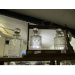 OAK AND BRASS FRAMED GLASS THREE BOTTLE TANTALUS