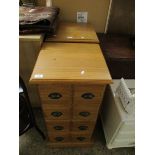 PAIR OF PINE FRAMED FOUR-DRAWER PILLAR TYPE CHESTS WITH CUP HANDLES