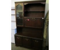 TEAK FRAMED SMALL LIVING ROOM DISPLAY CABINET WITH DROP FRONT WITH OPEN SHELF AND GLAZED DOOR, THE