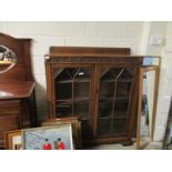 EARLY 20TH CENTURY OAK HEAVILY CARVED TWO-GLAZED DOOR BOOKCASE