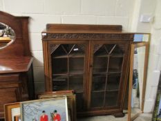 EARLY 20TH CENTURY OAK HEAVILY CARVED TWO-GLAZED DOOR BOOKCASE