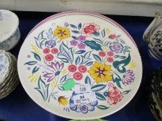 GROUP OF POOLE POTTERY WARES, THREE CHARGERS ALL WITH FLORAL DESIGNS WITHIN PINK BORDERS,