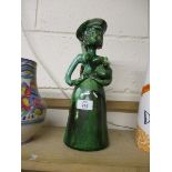 UNUSUAL POTTERY SCULPTURE OF A WOMAN WITH JAR UNDER HER ARM, GREEN GLAZED WITH MONOGRAM JJ TO