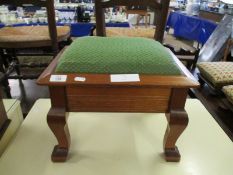TEAK FRAMED GREEN UPHOLSTERED TOP LIFT UP STOOL WITH A QUANTITY OF BOBBINS