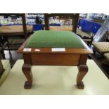 TEAK FRAMED GREEN UPHOLSTERED TOP LIFT UP STOOL WITH A QUANTITY OF BOBBINS