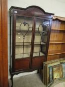 EDWARDIAN MAHOGANY ASTRAGAL GLAZED TWO-DOOR DISPLAY CASE RAISED ON SHAPED FEET