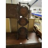 20TH CENTURY OAK FRAMED BARLEY TWIST SUPPORTED THREE TIER FOLDING CAKE STAND