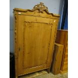CONTINENTAL PINE SINGLE DOOR CUPBOARD WITH CARVED CREST AND SHAPED SIDES WITH SINGLE CUPBOARD DOOR