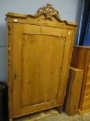 CONTINENTAL PINE SINGLE DOOR CUPBOARD WITH CARVED CREST AND SHAPED SIDES WITH SINGLE CUPBOARD DOOR