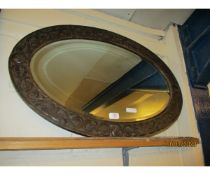 EARLY 20TH CENTURY OAK OVAL WALL MIRROR