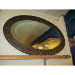 EARLY 20TH CENTURY OAK OVAL WALL MIRROR