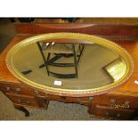 GILT FRAMED OVAL WALL MIRROR