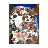 TIN CONTAINING VARIOUS BUTTONS, BELT BUCKLES ETC