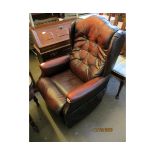 AN OX-BLOOD LEATHER AND BUTTON BACK RECLINER LAZYBOY ARMCHAIR