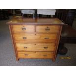 SATINWOOD TWO OVER THREE FULL WIDTH DRAWER CHEST WITH REEDED DETAIL AND BRASS SWING HANDLES