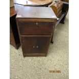 OAK FRAMED SIDE CUPBOARD WITH DROP FRONT OVER TWO CUPBOARD DOORS WITH BUTTON HANDLES