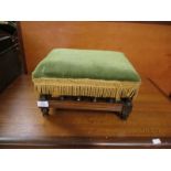 WALNUT FRAMED GREEN DRALON UPHOLSTERED SQUAT STOOL WITH SPINDLE SUPPORTS