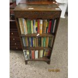 NARROW OAK OPEN FRONTED BOOKCASE WITH TWO SHELVES AND A QUANTITY OF VINTAGE BOOKS