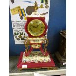 FRENCH PORCELAIN AND GILT MOUNTED MANTEL CLOCK WITH PAINTED FLORAL DETAIL
